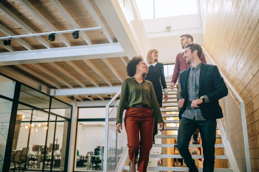 7 Ways to Sneak Workouts into Your Work Day 3 people talking stairs