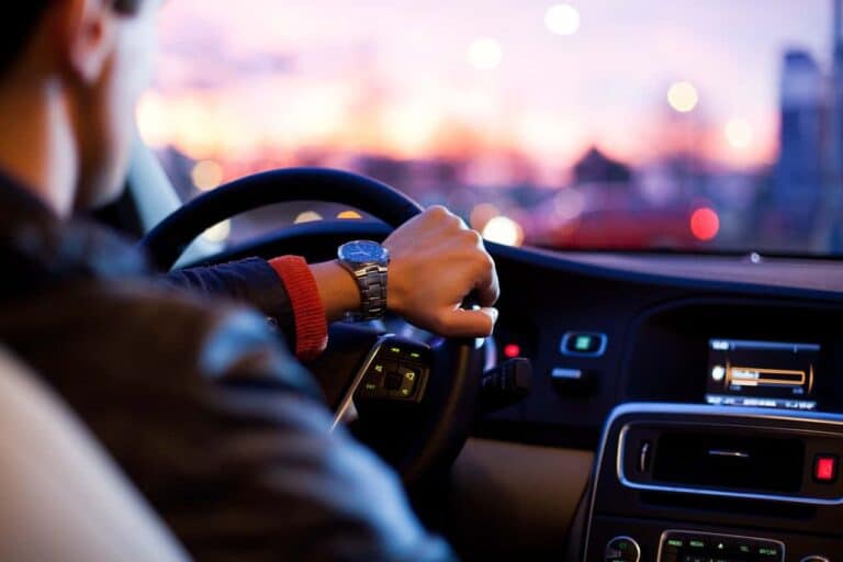 man driving car traffic