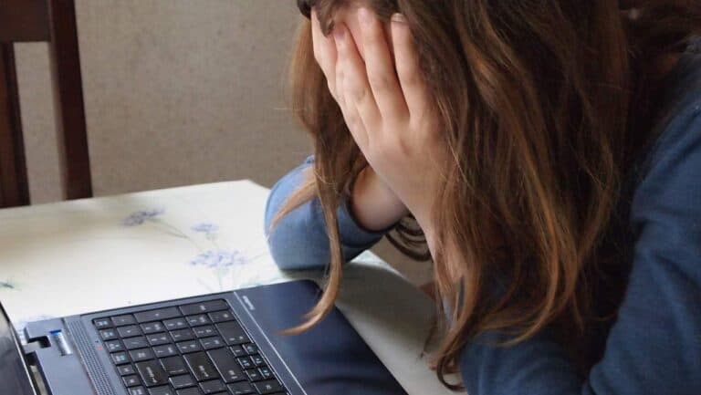 sad woman at computer