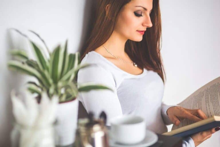 young woman reading book enlarged