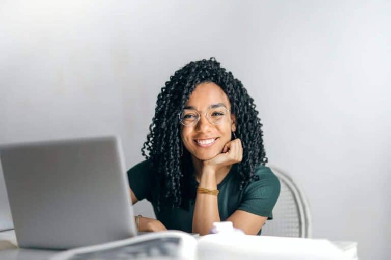 woman smiling at computer