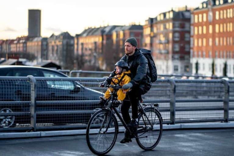 dad riding bike with child