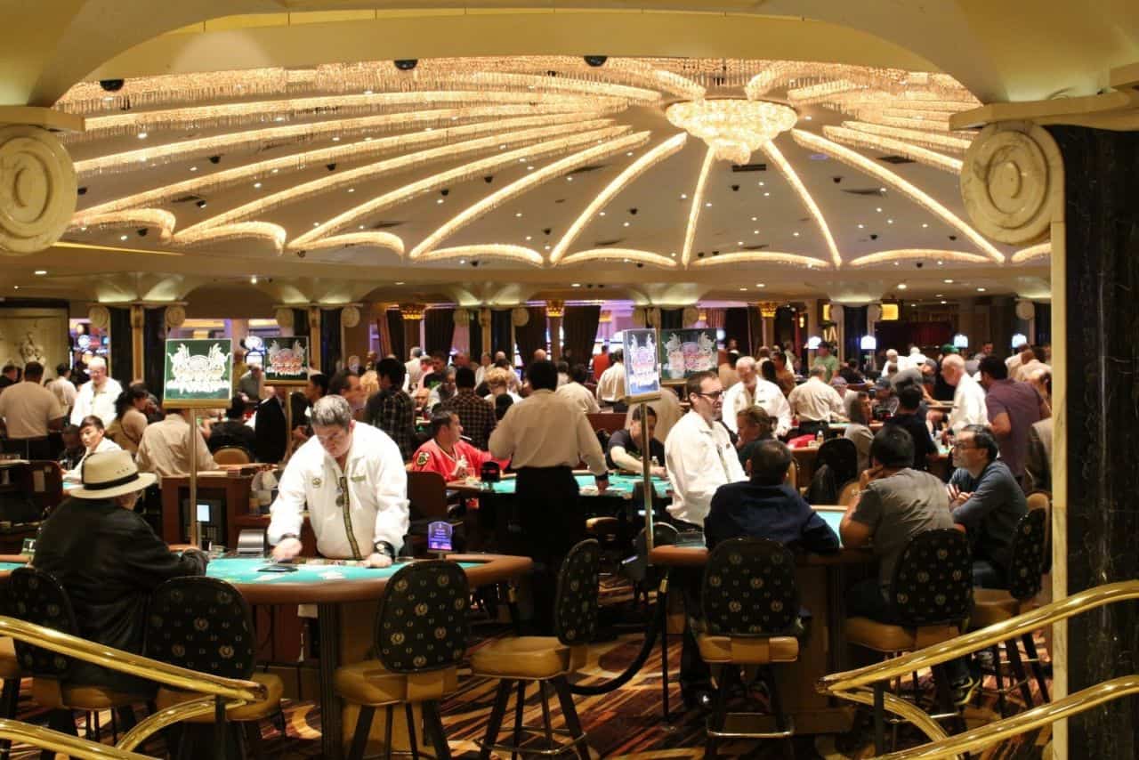 people gambling inside a casino in vegas