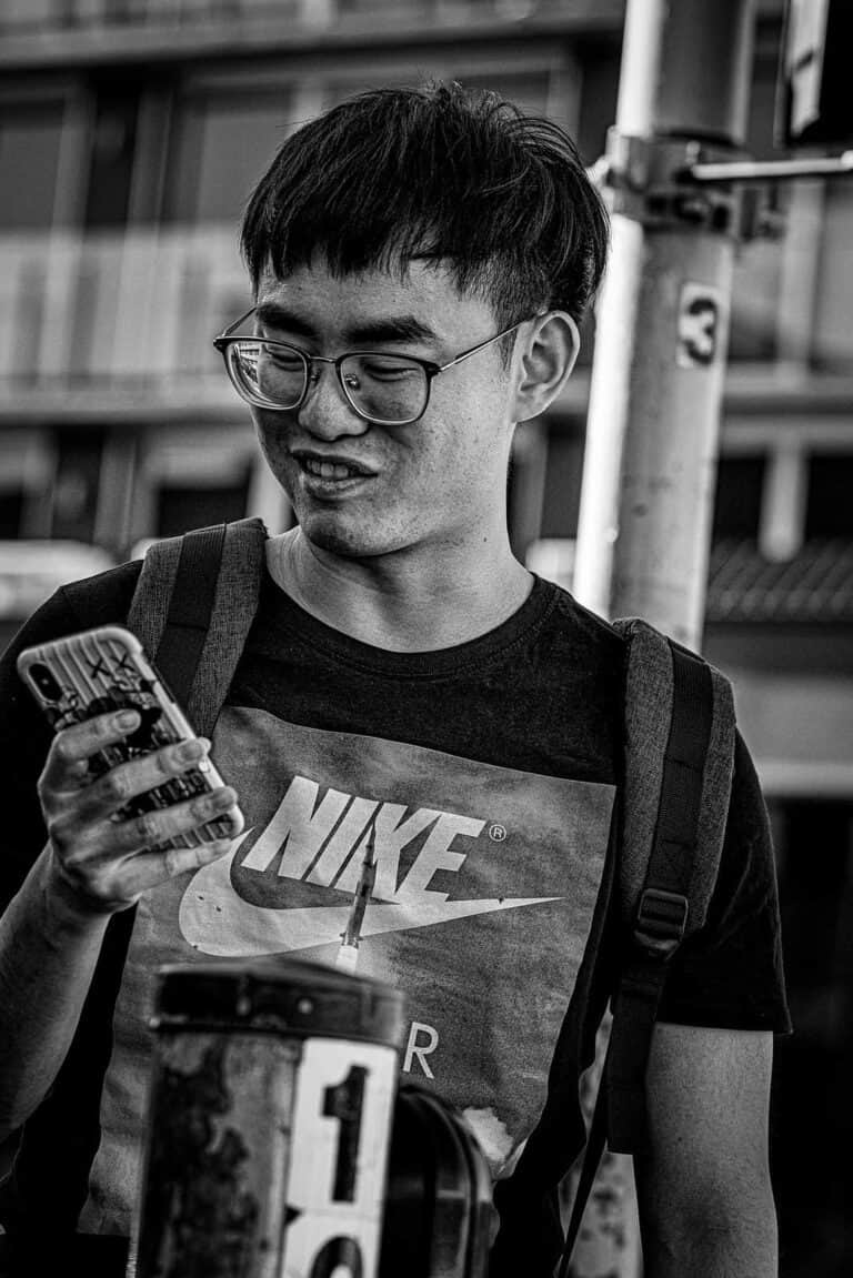 nerd looking at cellphone