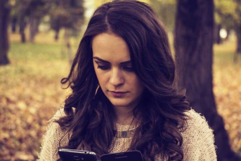 woman looking at her phone
