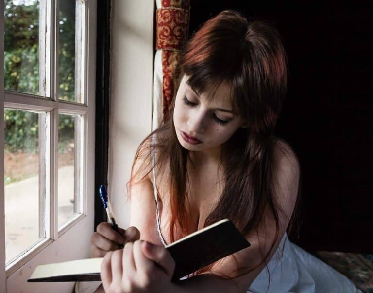 woman writing in journal