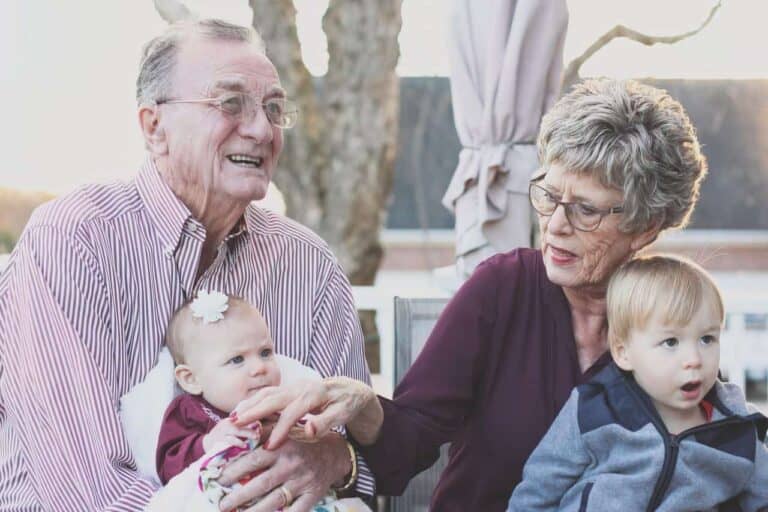grandparents holding kids