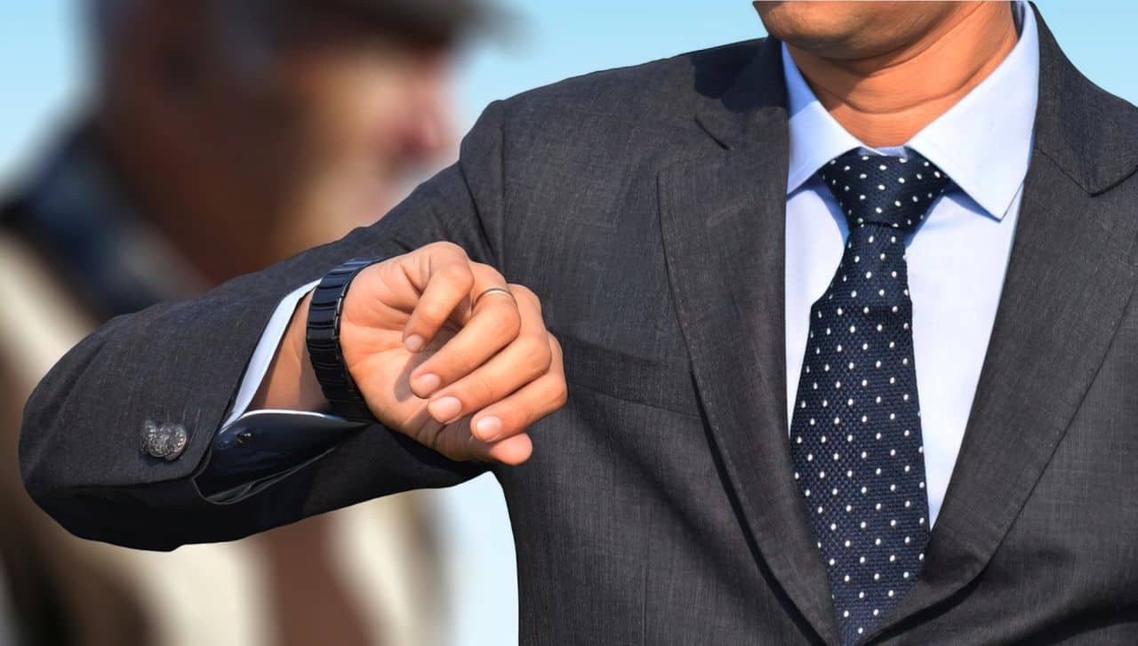 Things That Influence Men's Style That Isn't Clothes 2 man looking at watch upscaled