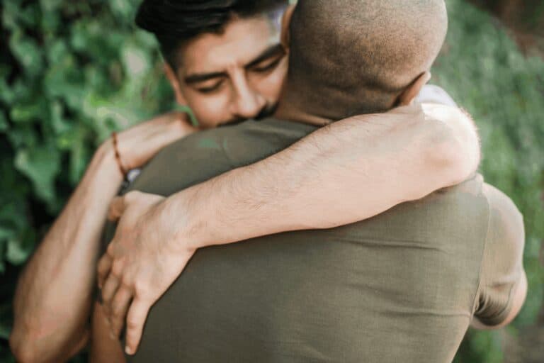 son hugging father