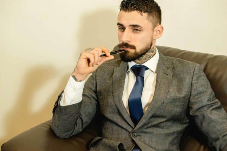 handsome man biting pen