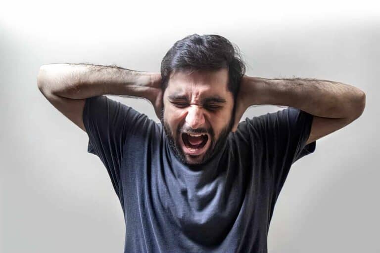 man yelling into the voice-