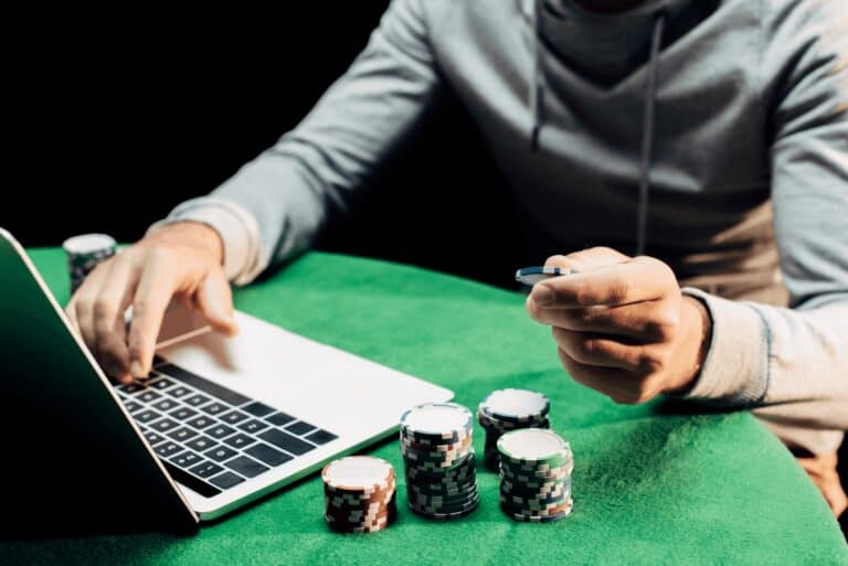 poker chips near laptop
