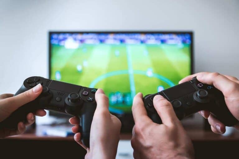 Guys playing FIFA Video Game