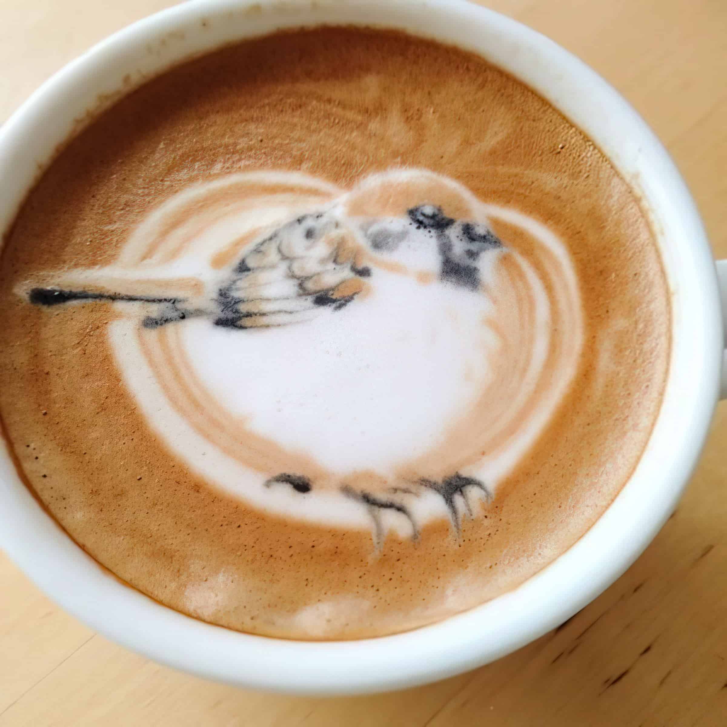 latte art of white bird