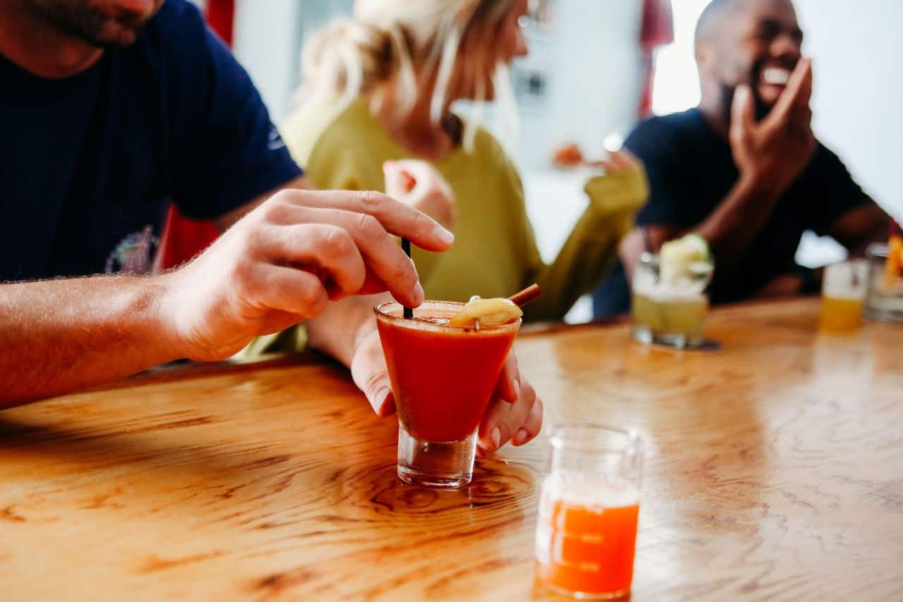 people drinking wild hare distillery cocktails