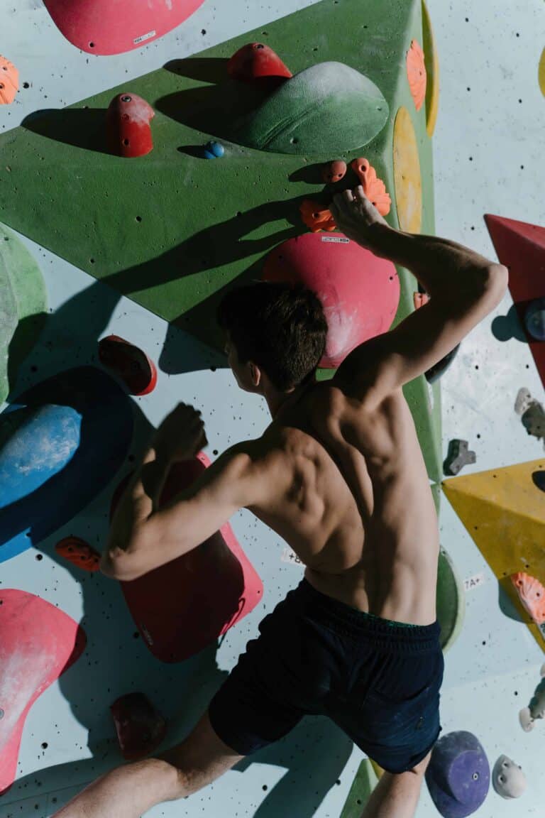 man climbing bouldering gym