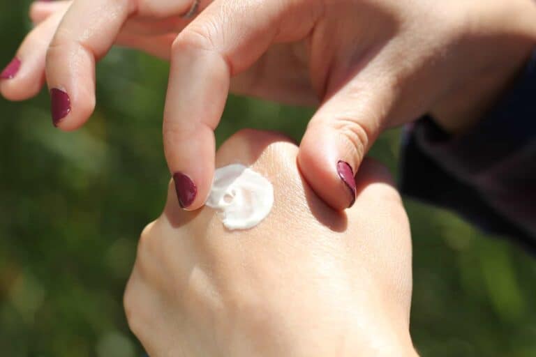 cream on womans hands