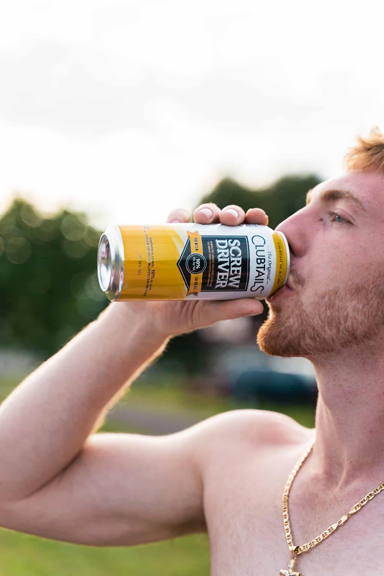 Elevate Your Party with Clubtails and Johny Bootlegger: The Perfect Ready to Drink Beverages for Men 2 drinking clubtails 1