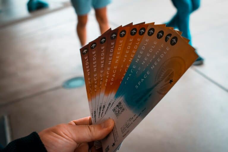 man holding tickets