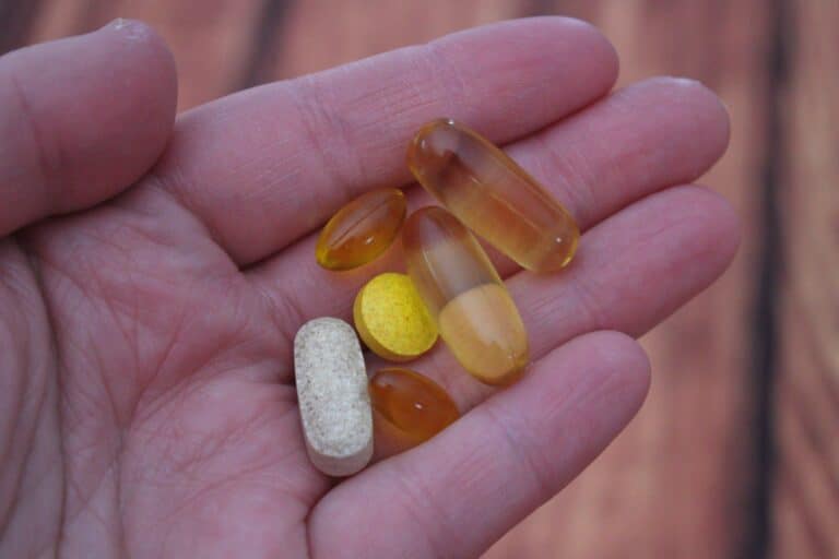 vitamin pills in hand