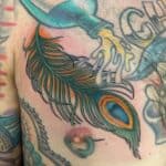 The Top 22 Feather Tattoo Designs For Men