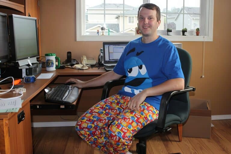 man working from home in pajamas