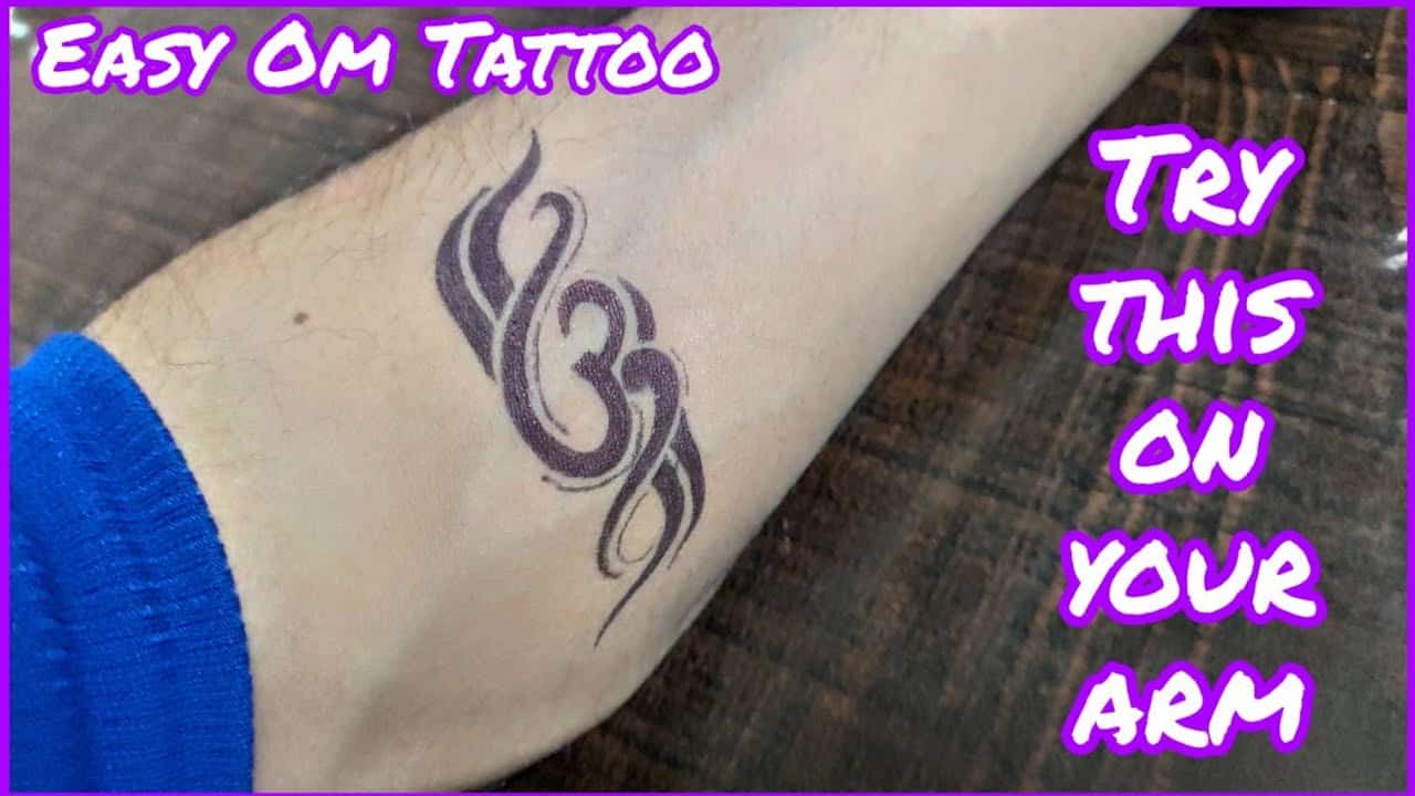 Om Symbol Tattoo On Finger Om Tattoo: Channeling Spiritual Power Of
