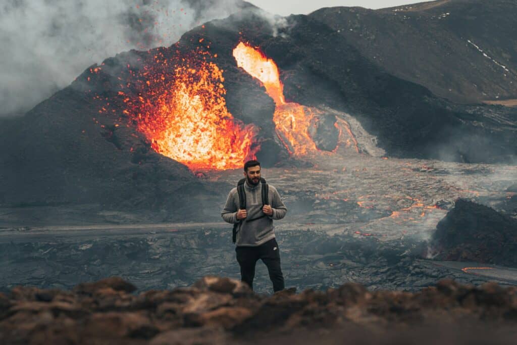 Top 9 Adventure-Fueled Escapes in Iceland for Men: Conquer the Land of Fire and Ice 4 man standing next to volcano in Iceland