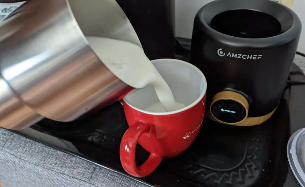 AMZCHEF Milk Frother Review: Worth the Whirl or Just Foam? 4 AMZCHEF Milk Frother Pouring Milk