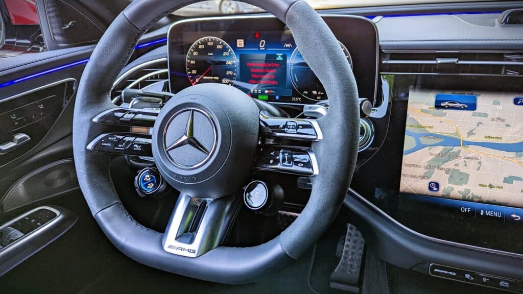 Luxury Mercedes-Benz car interior with digital dashboard and navigation system, showing modern technology and high-end design, perfect for automotive enthusiasts and tech lovers.