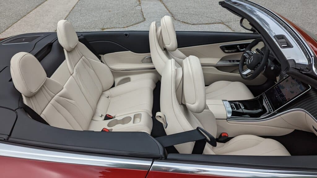 2025 Mercedes-Benz CLE 300 4MATIC Cabriolet Review 11 Luxurious cream leather interior of modern convertible sports car with advanced dashboard and touchscreen controls.