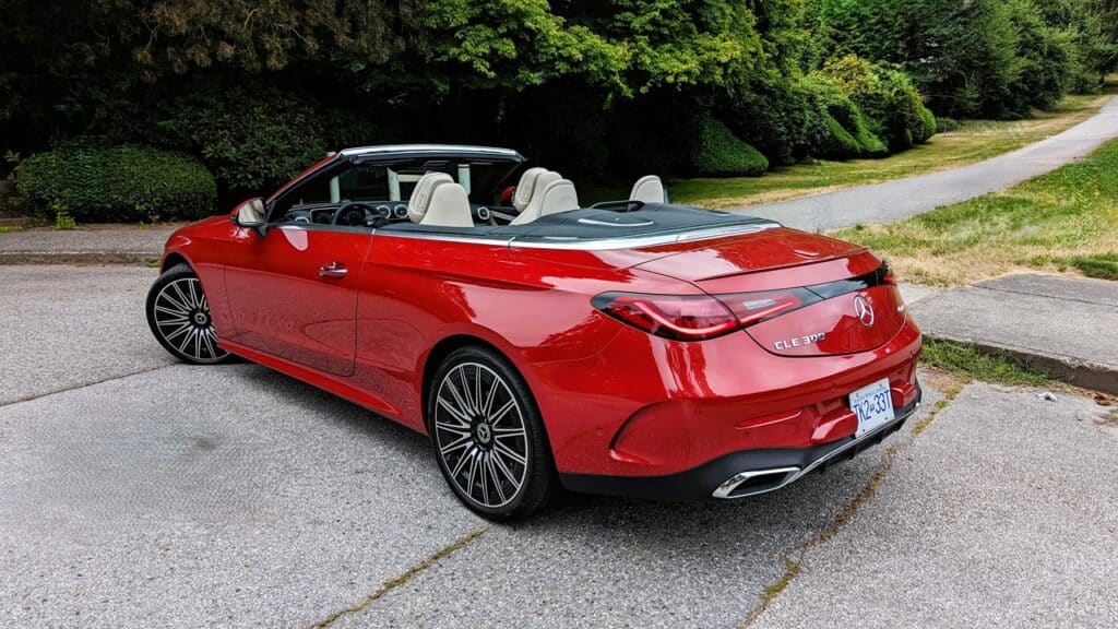 2025 Mercedes-Benz CLE 300 4MATIC Cabriolet Review 7 Luxurious red Mercedes-Benz convertible with beige interior parked on scenic roadside, emphasizing premium sports cars, automotive style, and high-performance vehicles for automotive enthusiasts.
