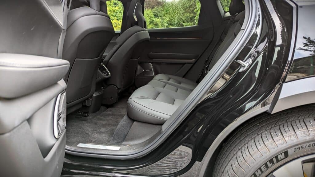 2025 Polestar 3 Long Range Dual Motor Review 11 Black SUV rear passenger seats, modern interior, comfortable leather seating, spacious vehicle cabins, automotive, travel, luxury transportation.