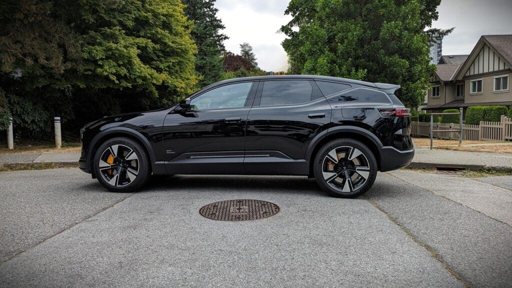 2025 Polestar 3 Long Range Dual Motor Review 7 Electric SUV parked on a suburban street, showcasing modern design and eco-friendly vehicle features.