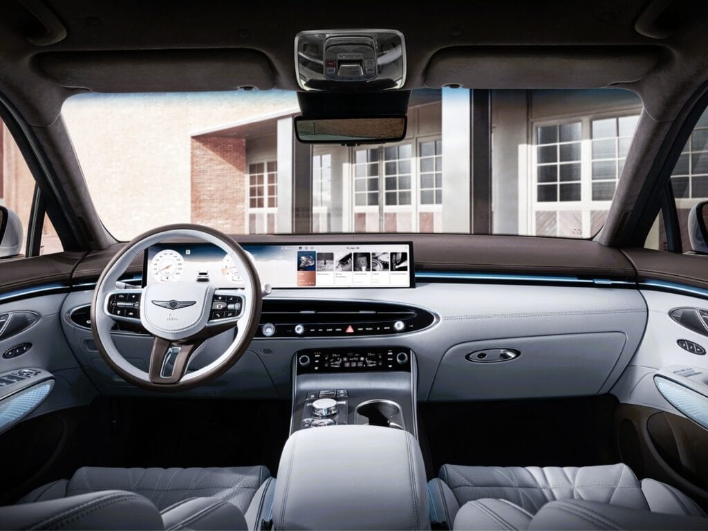 2026 Genesis GV70 Prestige 2.5T AWD Review 3 Interior view of a modern luxury car dashboard with digital displays and sleek design.
