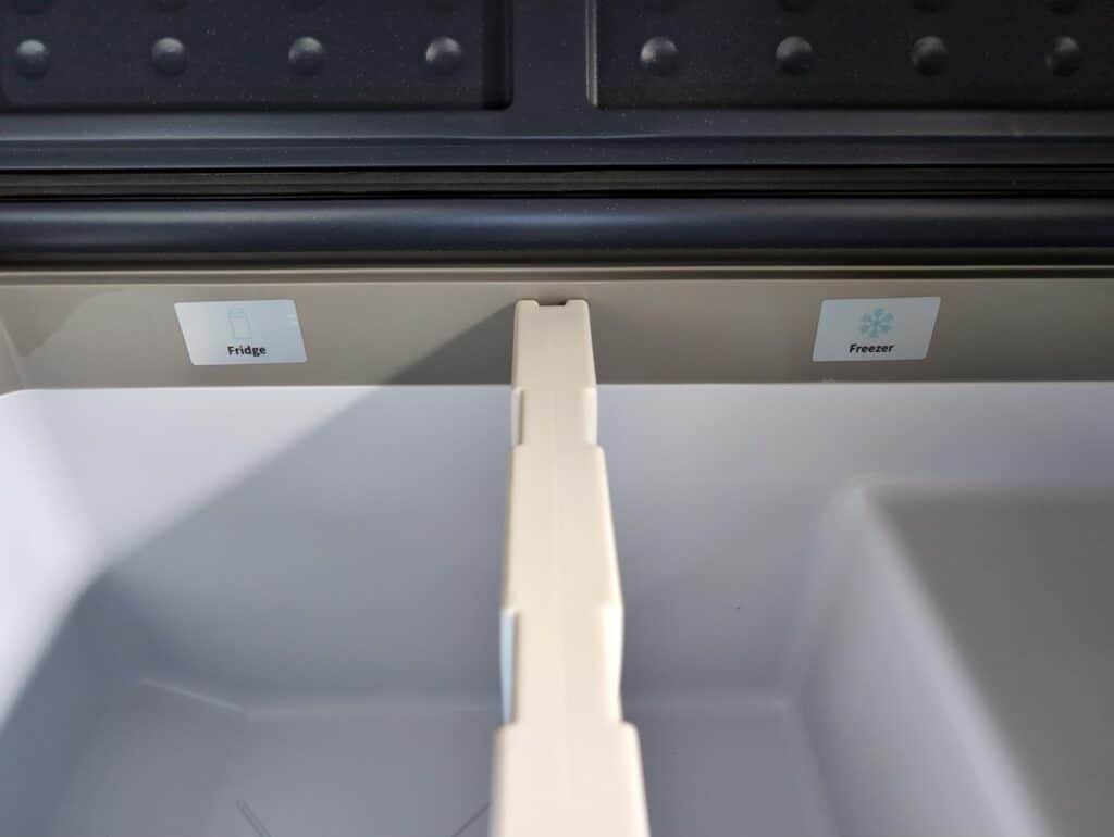 BODEGAcooler 36L Dual Zone 12V Portable Car Fridge Review 2 Empty refrigerator interior with labeled compartments for "Fridge" and "Freezer".
