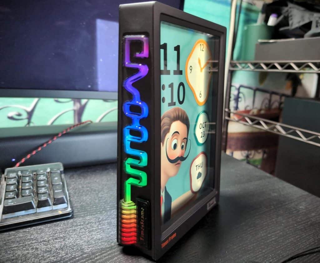 Divoom Times Frame Review 6 Digital clock with animated character and colorful LED side panel, modern desk accessories, innovative office decor, stylish tech gadgets, unique home office setup.