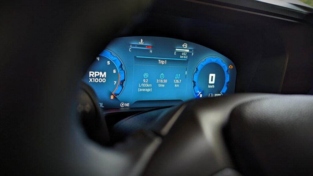 2025 Ford Bronco Sport Outer Banks Review 10 Digital car dashboard display showing speed, RPM, fuel level, trip information, and warning indicators; modern vehicle instrumentation for driver information.