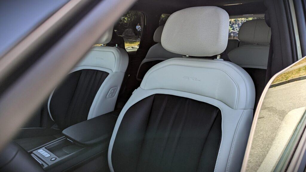 2025 Kia EV9 GT-Line Review 12 Luxury car interior featuring white and black leather seats with advanced comfort technology.