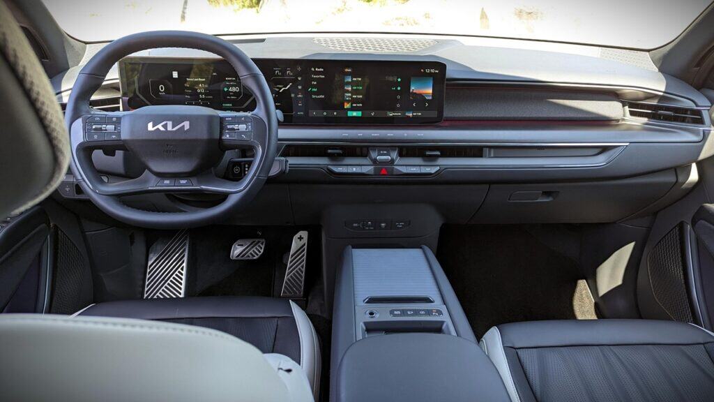 2025 Kia EV9 GT-Line Review 6 High-tech Kia vehicle interior with digital dashboard and advanced infotainment system. Modern car cockpit showcasing sleek design, digital displays, and premium controls for an upgraded driving experience.