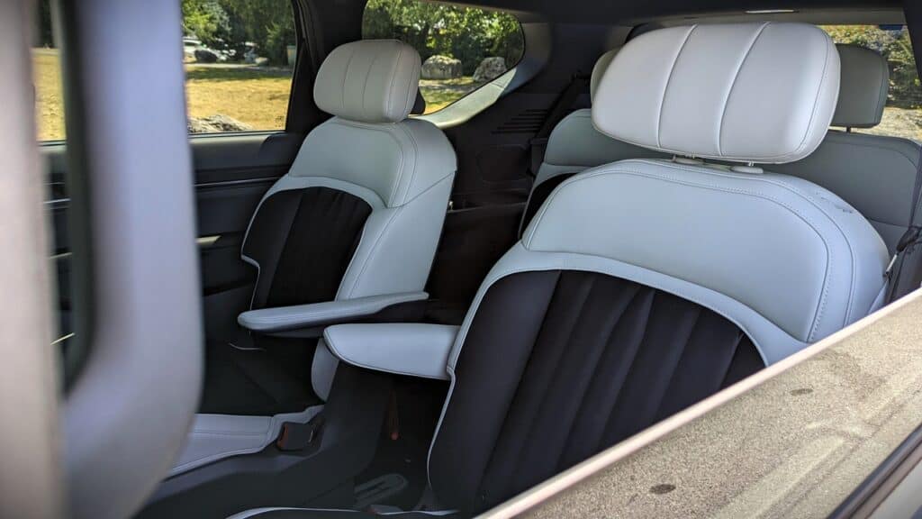 2025 Kia EV9 GT-Line Review 13 Comfortable white and black leather car seats inside a modern vehicle, ideal for luxury transportation, family trips, or executive travel. Perfect for car enthusiasts and interior auto design aficionados.