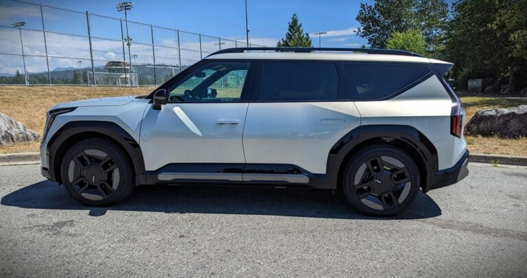 1. Electric SUV parked outdoors with a sporty design, black accents, and large wheels, showcasing modern features of the latest vehicle technology.