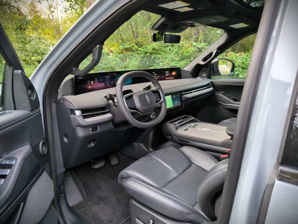 2025 Lincoln Navigator Reserve Review 11 High-tech luxury vehicle interior with digital dashboard and premium leather seats, showcasing modern automotive design, technology integration, and advanced driver-assistance features.