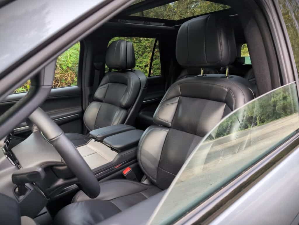 2025 Lincoln Navigator Reserve Review 12 Black leather car seats with headrests, showcasing luxurious interior and modern vehicle design.