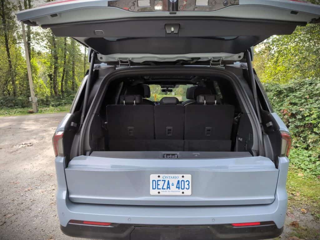 2025 Lincoln Navigator Reserve Review 10 Spacious SUV rear cargo area with open tailgate, black interior seats, and Ontario license plate, suitable for outdoor adventures or family trips.