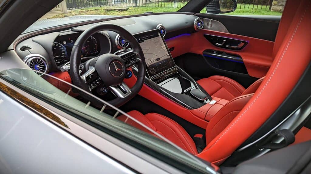 2025 Mercedes-AMG GT 63 4MATIC+ Coupe Review 6 Mercedes-Benz interior with red leather seats and advanced digital dashboard.