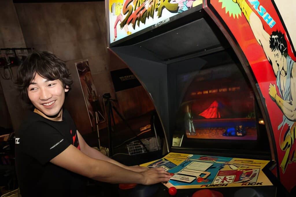 Daigo Umehara: The Legendary Beast's Complete Fighting Game Journey 3 Vibrant vintage pinball arcade game with a smiling person playing, colorful artwork, and a retro gaming atmosphere. Perfect for arcade gaming, classic pinball machines, and nostalgic entertainment.