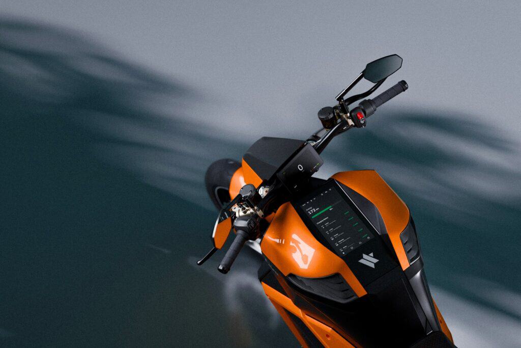 Verge TS Pro 2025 by Verge Motorcycles: 7 Next-Level Upgrades 2 Electric motorcycle with digital display and modern handlebars, designed for eco-friendly urban commuting and high-performance riding. Features advanced technology and a sleek orange and black aesthetic.