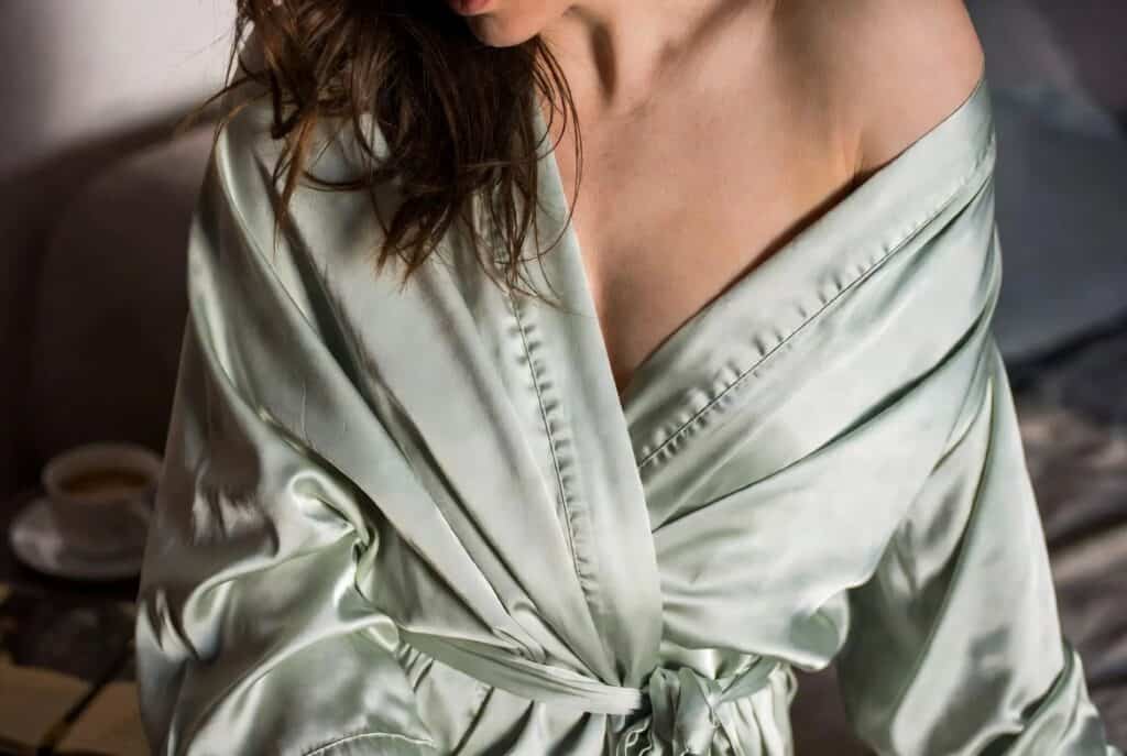 Elegant satin robe in soft champagne color, highlighting delicate fabric and relaxed fit, perfect for a shy girlfriend exploring comfortable lingerie options.