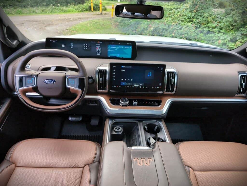2025 Ford Expedition King Ranch Review 4 Ford vehicle interior with digital dashboard display, infotainment touchscreen, and ergonomic controls, highlighting innovation and luxury in modern automotive design.